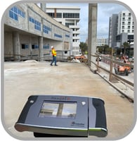 Flexijet for construction industry image of Flexijet on construction site single operator in high viz taking measurement of beam. Real time photo of measurement image on screen.